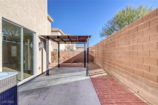 view of patio featuring cooling unit and a pergola