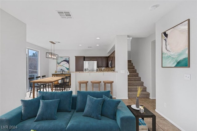 living room with light tile patterned floors