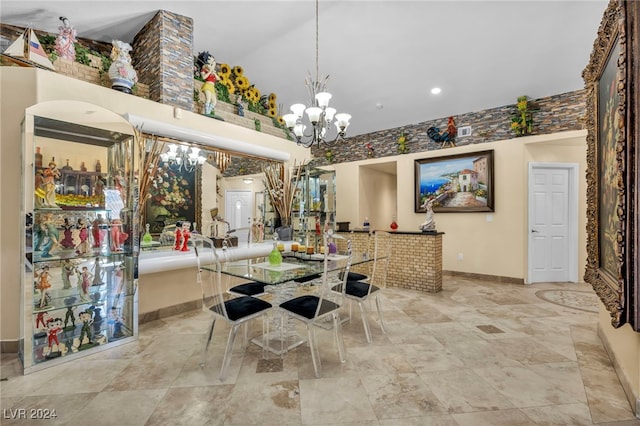 dining space with an inviting chandelier