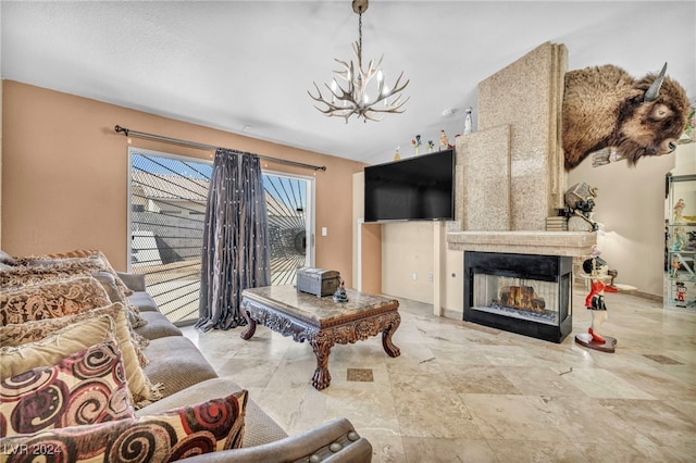 living room with a multi sided fireplace and a notable chandelier