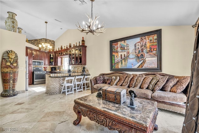 living room featuring vaulted ceiling and an inviting chandelier