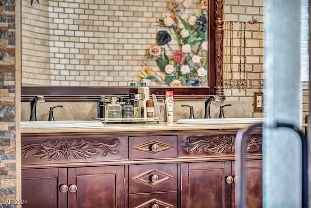 bar featuring sink and backsplash