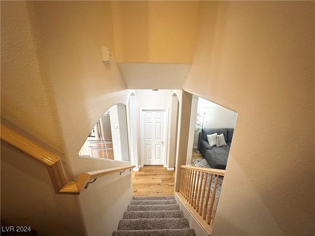 staircase featuring hardwood / wood-style floors