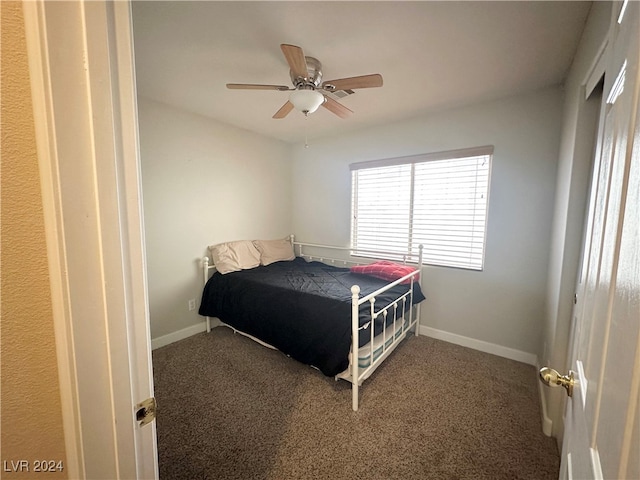 bedroom with ceiling fan and carpet flooring