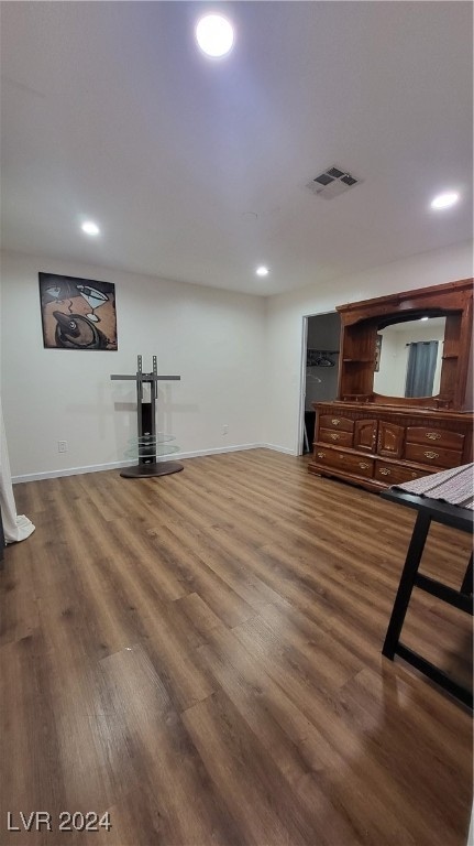 unfurnished living room featuring hardwood / wood-style flooring