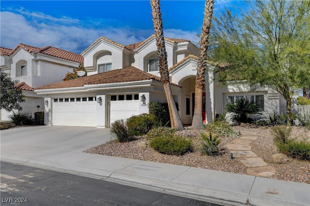 mediterranean / spanish-style house featuring a garage