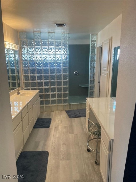 bathroom featuring hardwood / wood-style flooring and vanity