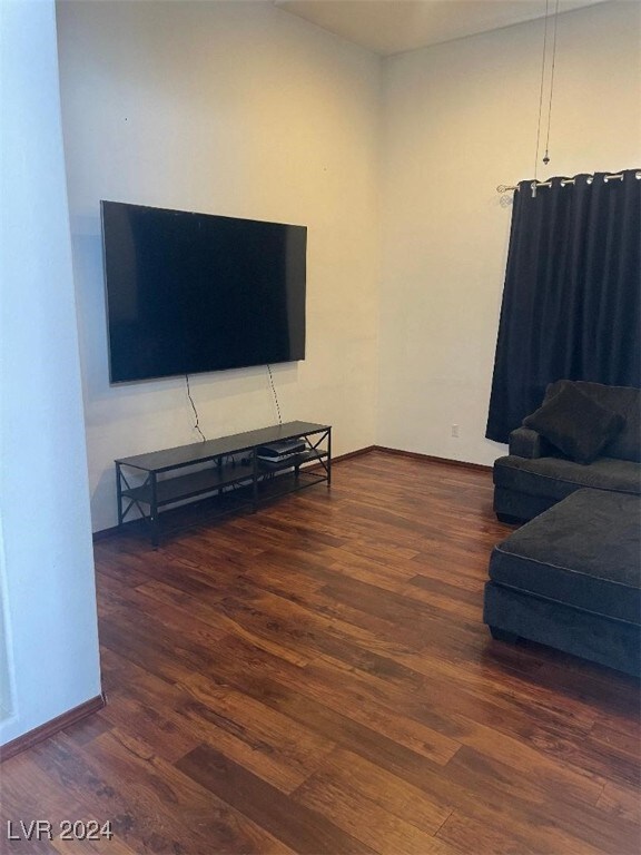 living room with dark hardwood / wood-style flooring