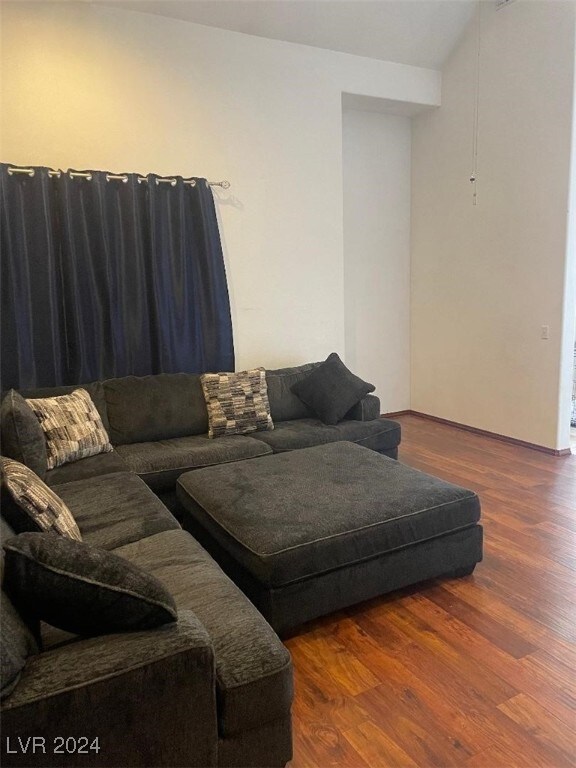 living room with dark wood-type flooring