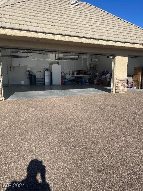 garage with white refrigerator