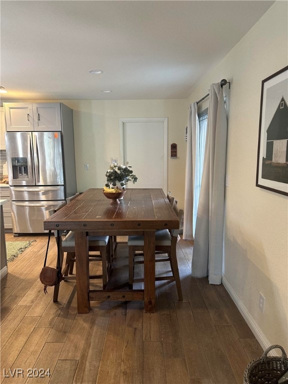 dining area featuring dark hardwood / wood-style flooring