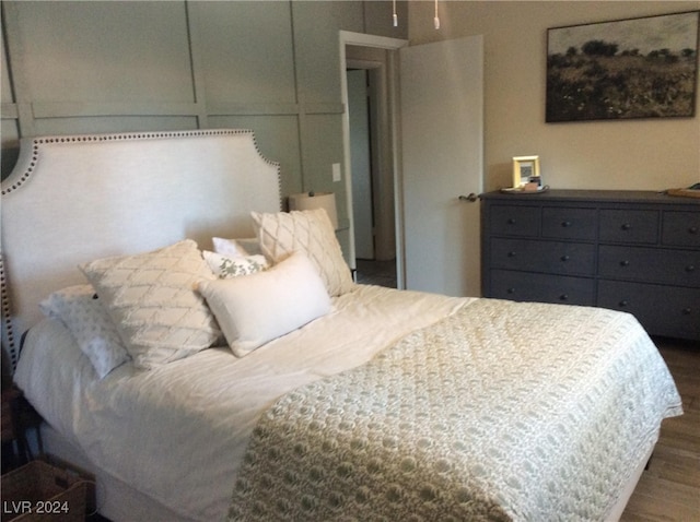 bedroom featuring dark hardwood / wood-style flooring