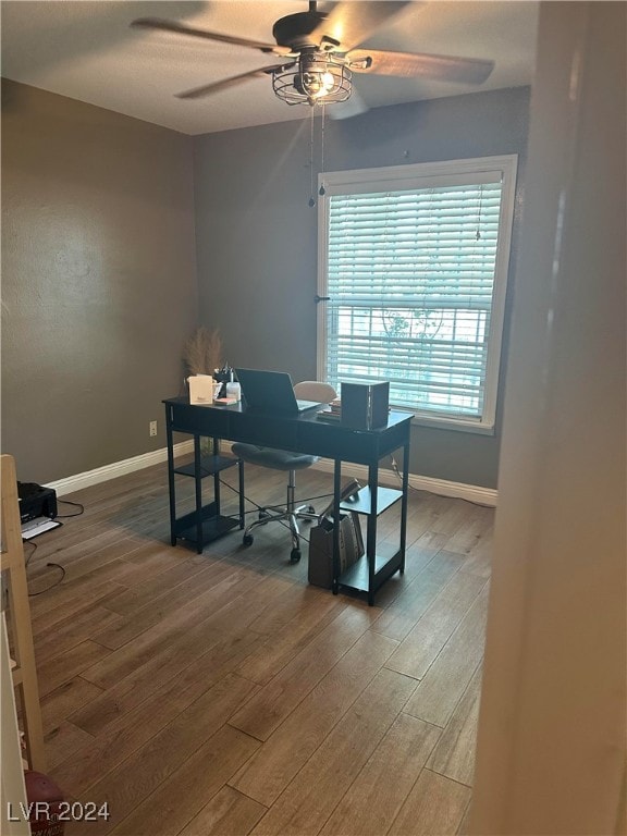 home office with ceiling fan and wood-type flooring