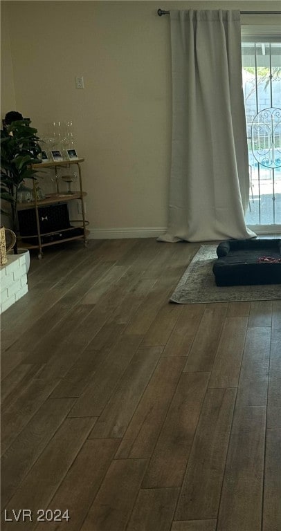 spare room featuring dark hardwood / wood-style flooring