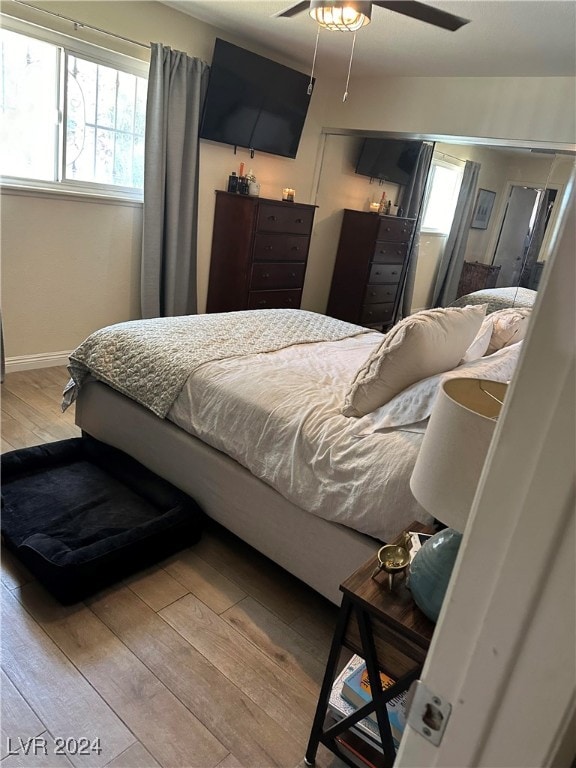 bedroom featuring ceiling fan and light wood-type flooring