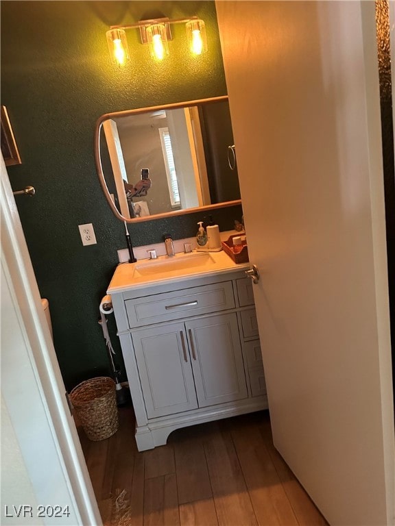 bathroom featuring vanity and wood-type flooring