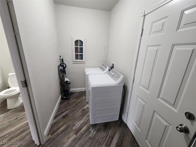 washroom with dark wood-type flooring and washing machine and clothes dryer