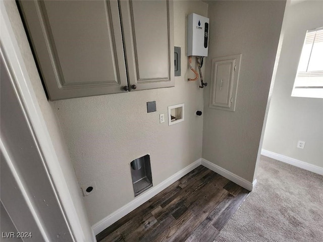 clothes washing area featuring electric panel, water heater, hardwood / wood-style floors, and hookup for a washing machine