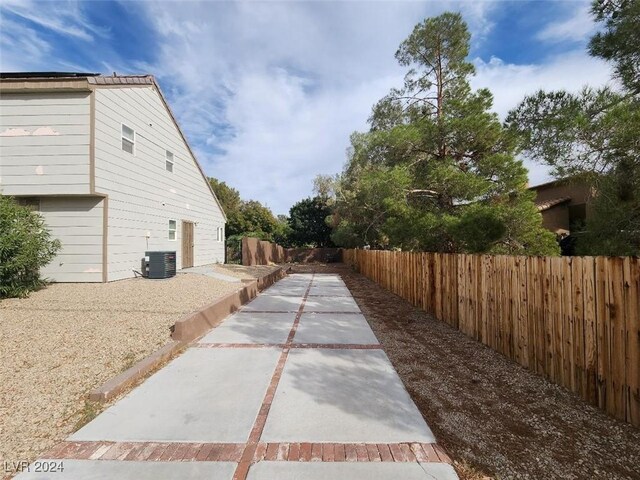 view of side of home featuring central AC