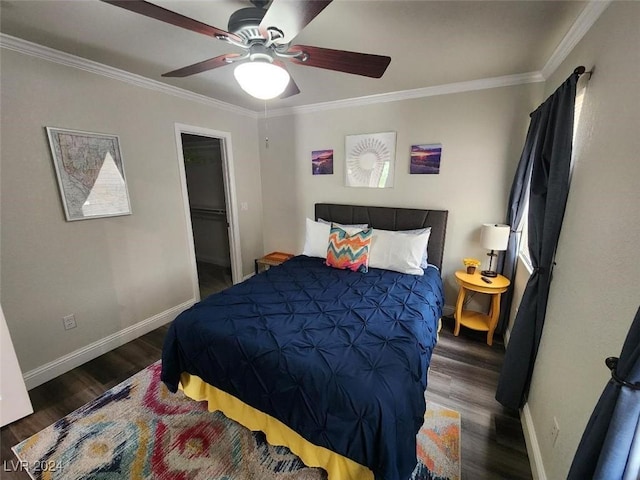 bedroom with a spacious closet, a closet, ceiling fan, and dark wood-type flooring