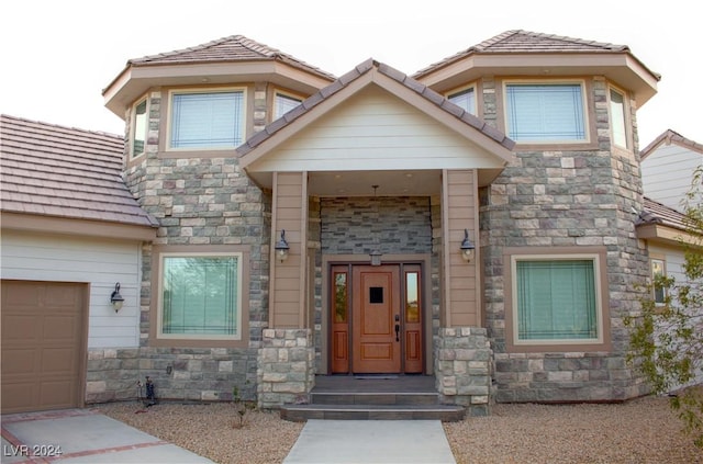 entrance to property featuring a garage