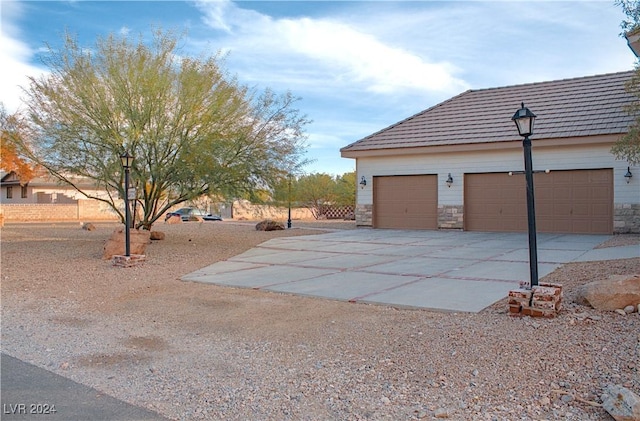 exterior space with an outdoor structure and a garage