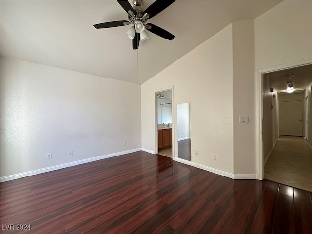 unfurnished bedroom with dark wood-type flooring, ceiling fan, and high vaulted ceiling