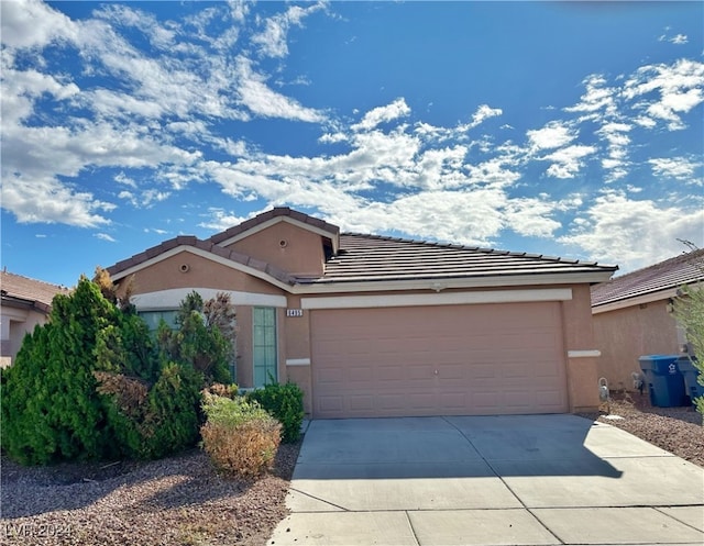 ranch-style house featuring a garage