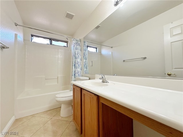 full bathroom featuring vanity, toilet, tile patterned floors, and shower / bath combo