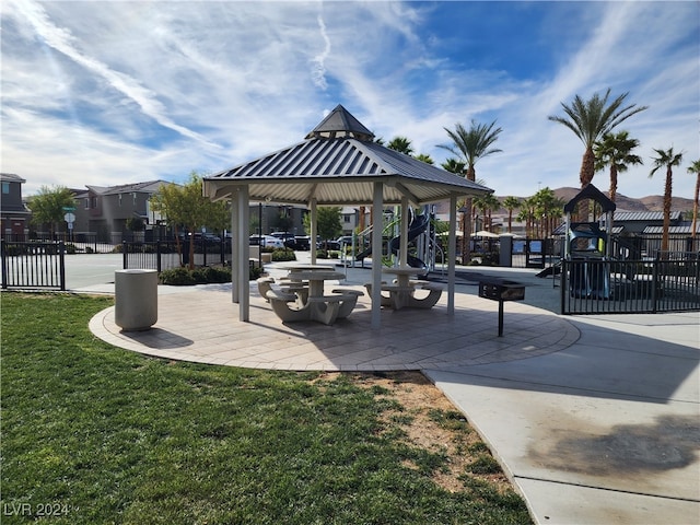 surrounding community with a gazebo and a yard