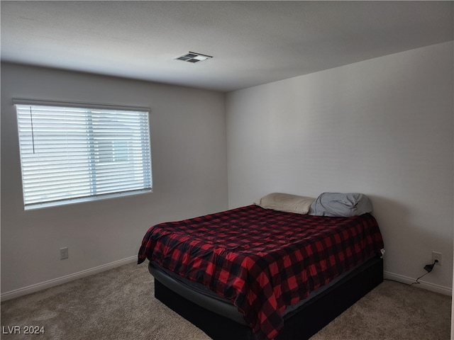 bedroom featuring carpet