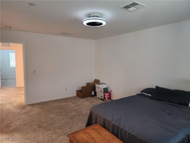 bedroom featuring light carpet