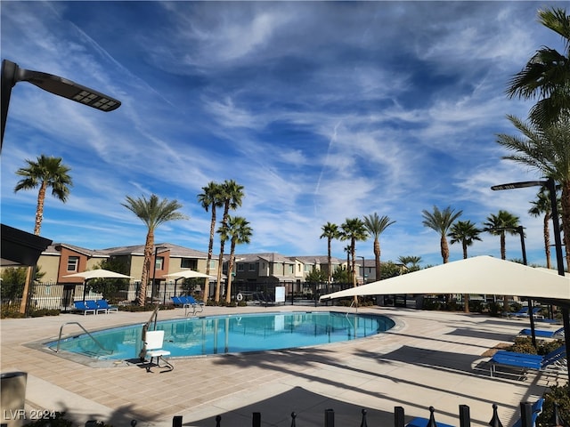 view of swimming pool featuring a patio area