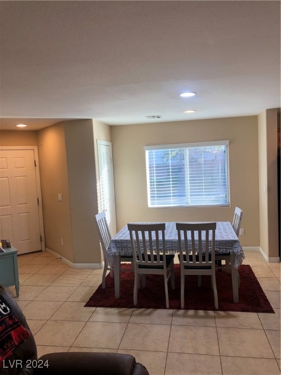 view of tiled dining space