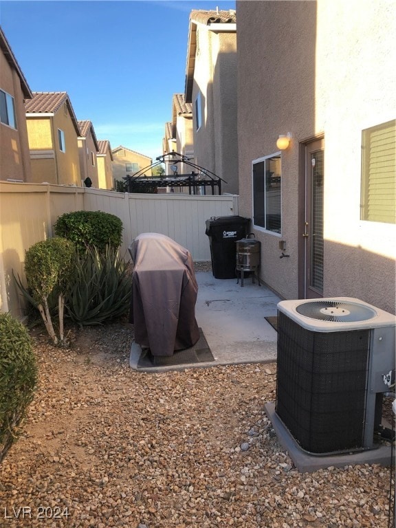 view of yard featuring a patio and central AC unit