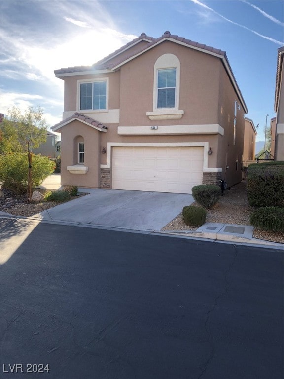 front of property with a garage