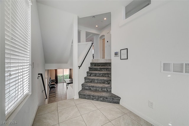 staircase with tile patterned floors