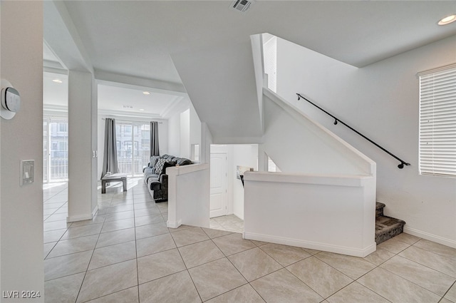 staircase featuring tile patterned floors