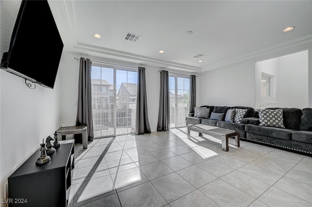 living room with crown molding and light tile patterned floors