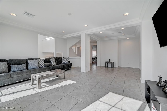 living room featuring crown molding and light tile patterned floors