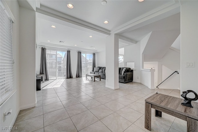 interior space featuring ornamental molding and light tile patterned flooring