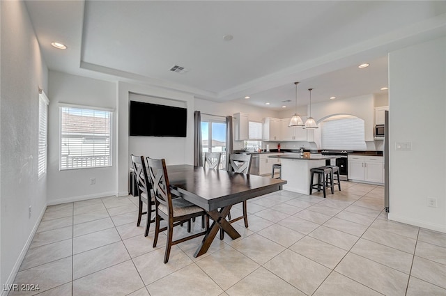 dining area featuring light tile patterned flooring