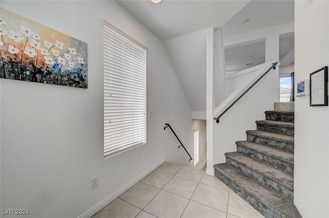 stairs featuring tile patterned flooring