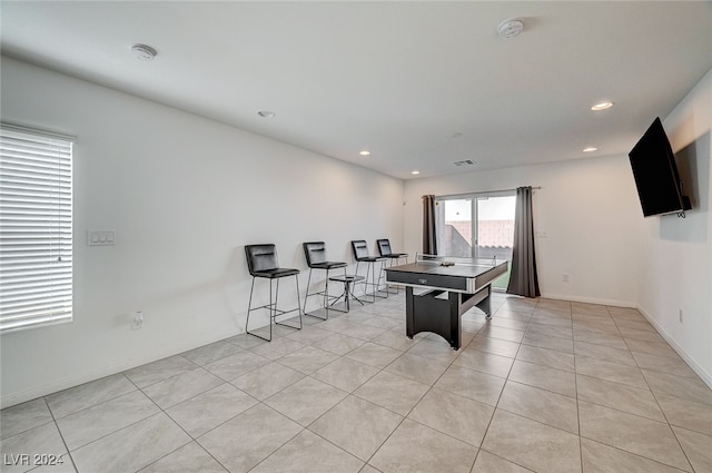 recreation room featuring light tile patterned floors