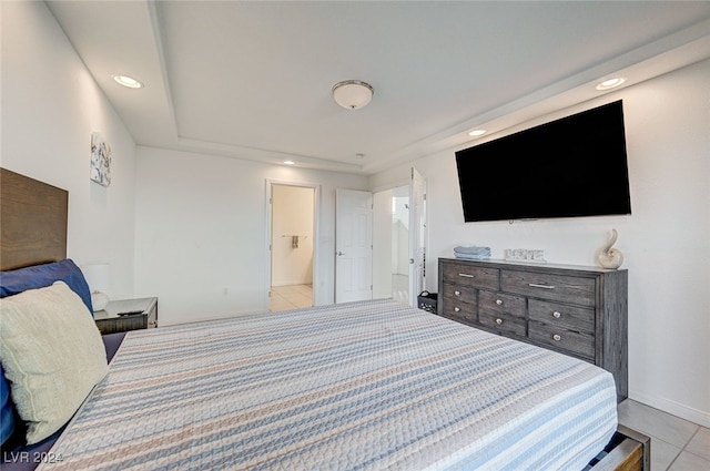 tiled bedroom featuring ensuite bathroom