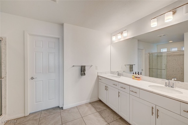 bathroom with vanity, tile patterned floors, and an enclosed shower