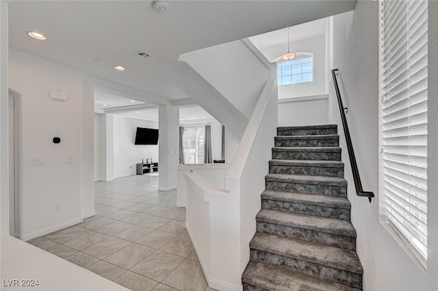 stairway featuring tile patterned floors