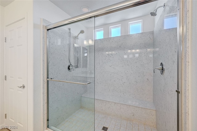 bathroom featuring an enclosed shower