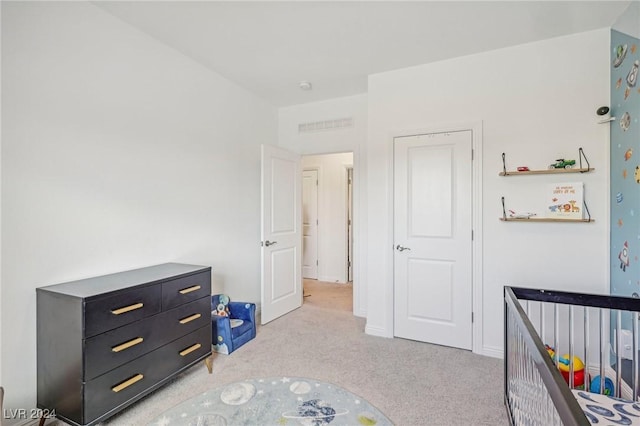 unfurnished bedroom featuring light colored carpet