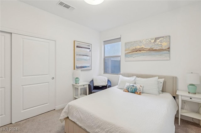 carpeted bedroom with a closet